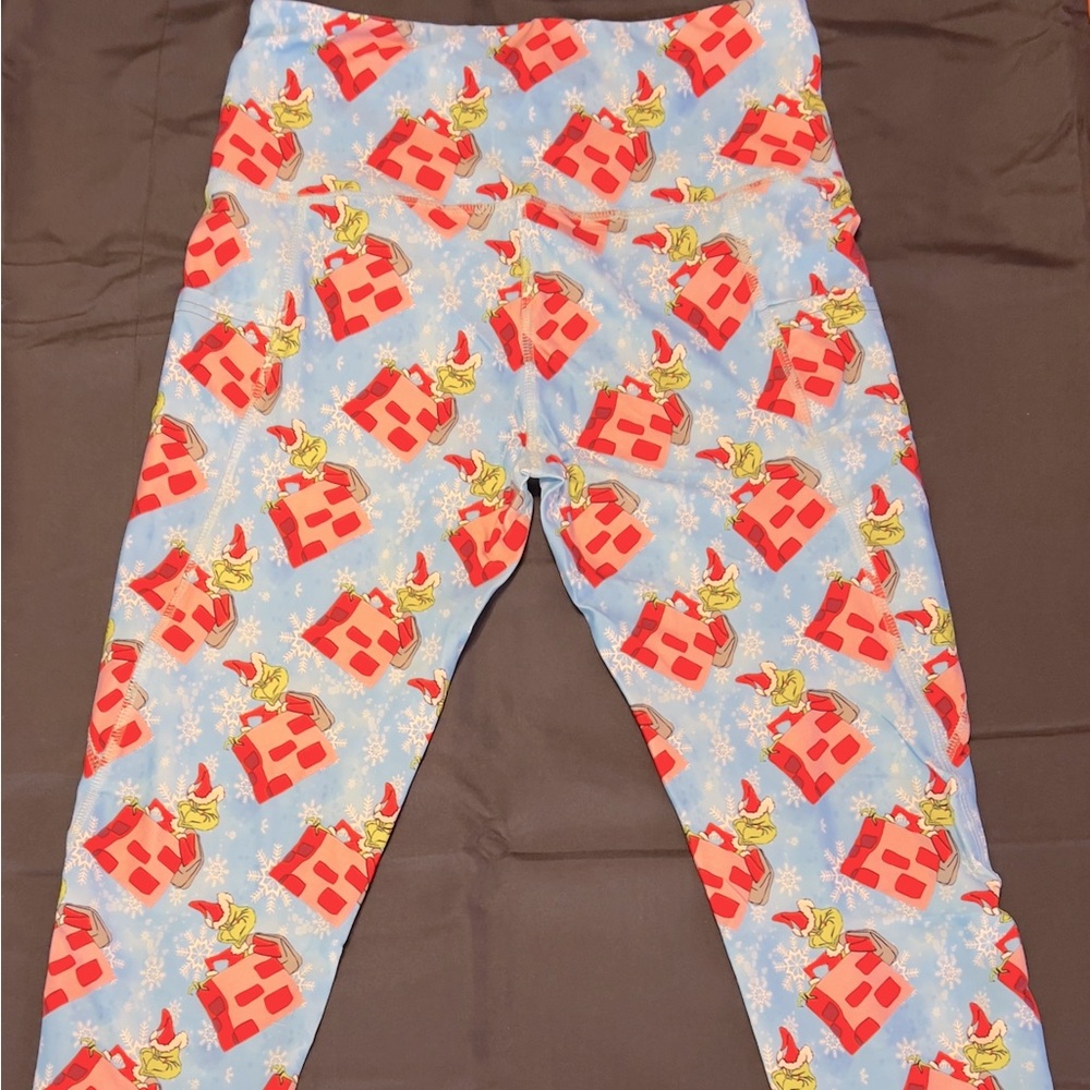 Have fun during the holidays wearing a pair of The Grinch Leggings!
